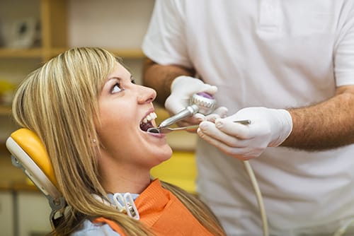 Dental work on smiling woman at Badr Dental